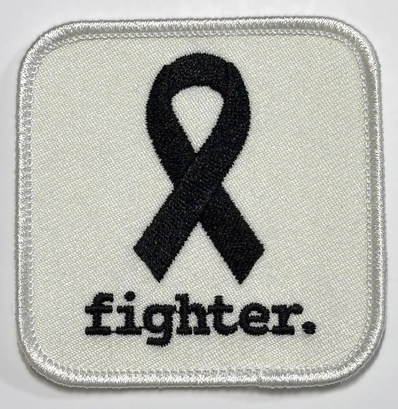 Square Patch — Black Ribbon — fighter. — White Background