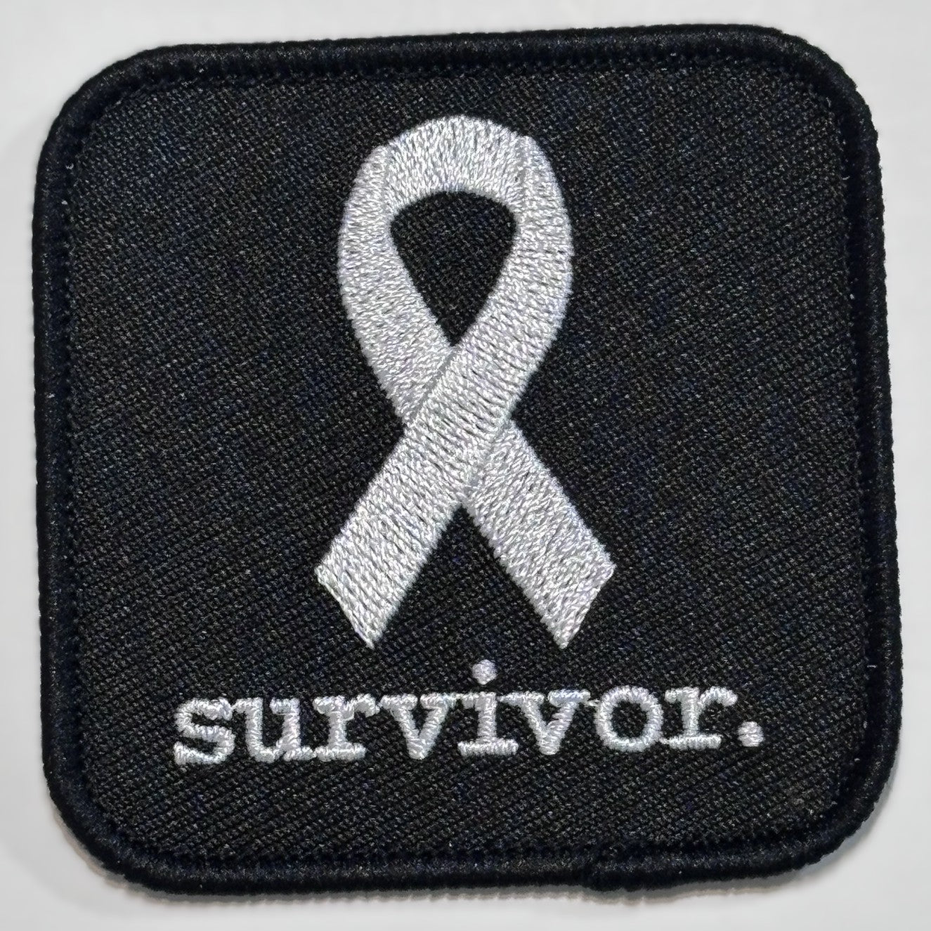 Square Patch — White Ribbon — survivor. — Black Background